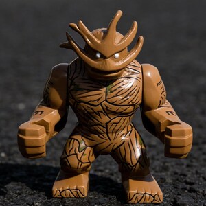 May include: A brown action figure of a tree-like creature with a stern expression. The figure has a detailed, textured design with dark brown lines and green accents. It stands with its fists clenched, showcasing a muscular build.