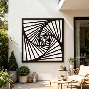 May include: A large, square black metal wall art piece with a geometric spiral design. The artwork is mounted on a white wall, creating a striking contrast. The outdoor setting includes potted plants and patio furniture.