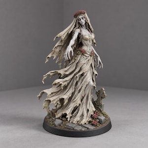 May include: A detailed figurine of a ghostly bride wearing a tattered, off-white gown and a veil adorned with red roses. The figure stands on a base featuring stone rubble, a small tombstone, and scattered red roses, with a pale, gaunt appearance.