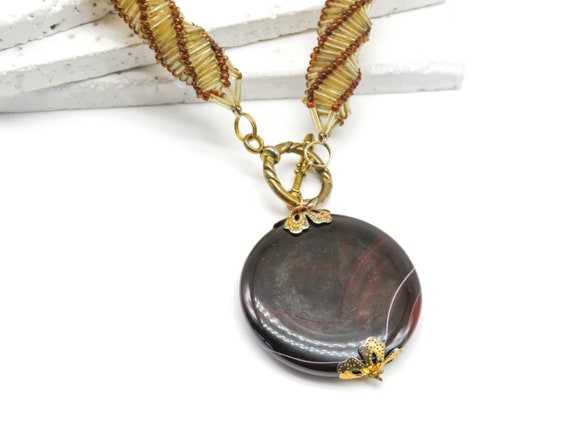 Orchid Jewelry 35 Natural Oval Brown Agate Sterling Silver Pendant Necklace With an 18 Inch Chain A Lovely Long Chain Pendant Necklace Set For Women In Silver With A Vintage Vibe Orchid Jewelry 35 Natural Oval Brown Agate Sterling Silver Pendant Necklace With an 18 Inch Chain A Lovely Long Chain Pendant Necklace Set For Women In Silver With A Vintage Vibe