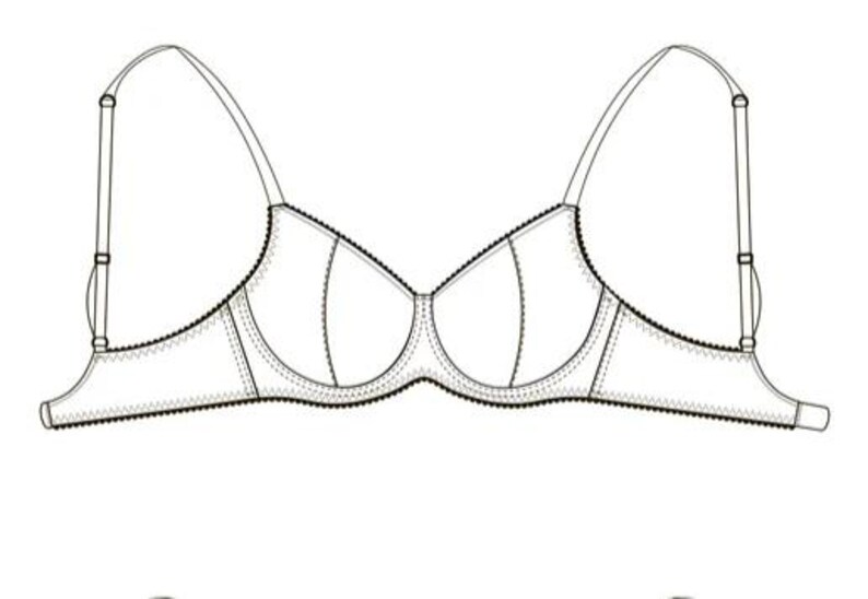 May include: A white bra with adjustable straps and a classic design. The bra features a structured silhouette with seaming details and a scalloped edge along the bottom. The straps are thin and adjustable.