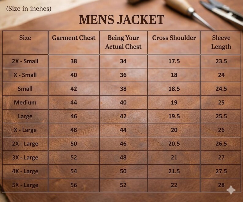 May include: A brown leather table displays a size chart for a men's jacket. The chart includes measurements for garment chest, actual chest, cross shoulder, and sleeve length in inches, ranging from 2X-Small to 5X-Large.