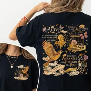 May include: A white ceramic mug with a black handle and the text "But First, Coffee" in a black, bold font. The mug is on a white surface.