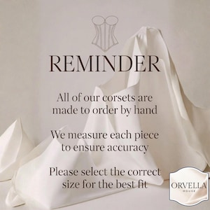 May include: A reminder graphic with text about made-to-order corsets. The text includes "REMINDER", "All of our corsets are made to order by hand", "We measure each piece to ensure accuracy", and "Please select the correct size for the best fit". A corset illustration is at the top.