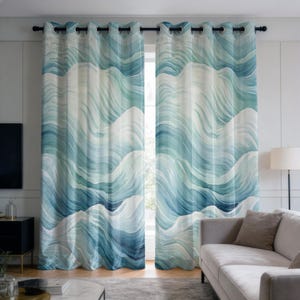 May include: A pair of window curtains featuring a watercolour wave design in shades of blue and white. The curtains hang from a black rod with silver eyelets. The curtains are open, showing a view of the outside.