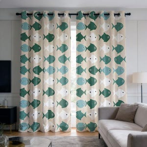 May include: Two beige curtain panels with a repeating pattern of stylized fish in teal, white, and light blue. The curtains are hung on a black rod with silver grommets. The curtains are in a living room setting.