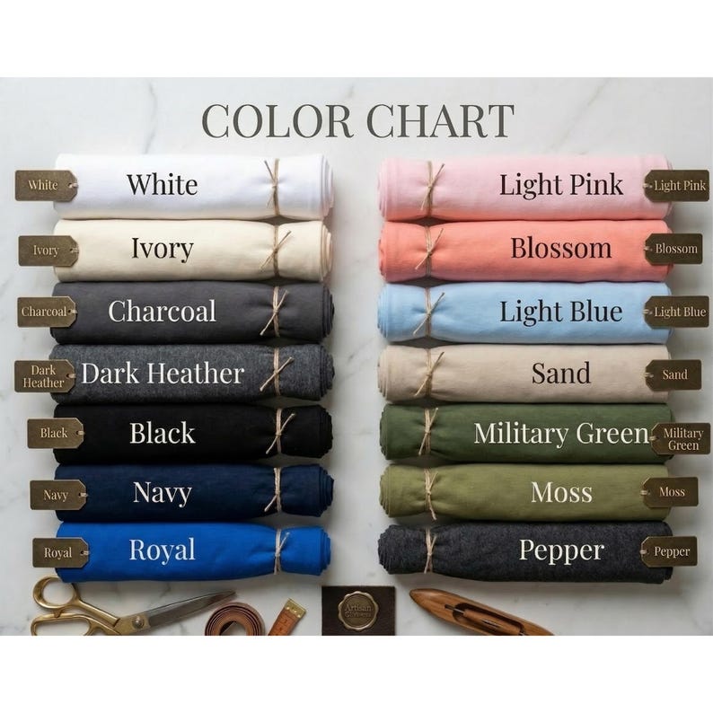 Puede incluir: Una carta de colores que muestra varias muestras de tela enrolladas y atadas con hilo. Los colores incluyen blanco, marfil, carb&oacute;n, gris oscuro, negro, azul marino, real, rosa claro, flor, azul claro, arena y pimienta.