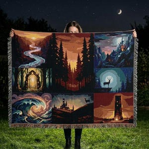 May include: A woven tapestry blanket featuring six landscape scenes with trees, rivers, and castles. The color palette includes shades of orange, brown, and blue. The blanket has a fringed edge and is held up against a night sky with a crescent moon.