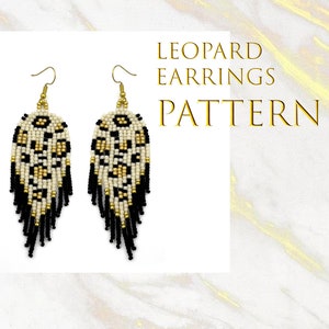 May include: A pair of dangle earrings with a white and gold leopard print pattern and black fringe. The earrings are made with beads and have gold hooks. The text "LEOPARD EARRINGS PATTERN" is written in gold letters on a white background.