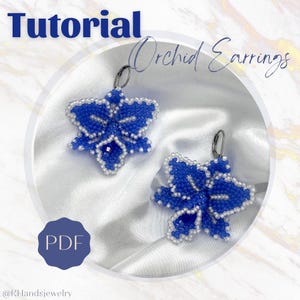 May include: A PDF tutorial for making orchid earrings. The earrings are made with blue and white beads and are shown on a white background. The text "Orchid Earrings" is written in black above the earrings. The text "Tutorial" is written in black at the top of the image. The text "PDF" is written in white on a blue circle at the bottom of the image.