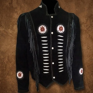 May include: Black suede jacket with white stitching and fringe detailing. The jacket features decorative circular patches with red and white accents, and white button closures. A unique piece of outerwear.