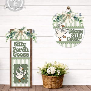 May include: A rectangular wooden sign with the text Silly Porch Goose and a round sign with the text Welcome Silly Goose, both featuring a white goose illustration, sage green striped patterns, eucalyptus greenery, and a beige ribbon bow.