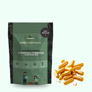 May include: A green pouch of Herbelle Naturals Cultivated Organic Turmeric Formula Capsules with a "100% Natural" seal. A pile of golden-yellow capsules is to the right. The pouch has illustrations of people and icons.