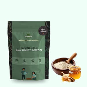 May include: A green package of Herbelle Naturals Cultivated Organic Raw Honey Powder with a 100% Natural seal. A wooden bowl of powder, a jar of honey, and honeycomb are also shown.