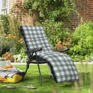 May include: A white ceramic mug with a black handle and the text "But First, Coffee" in a black, handwritten-style font. The mug is on a white surface.