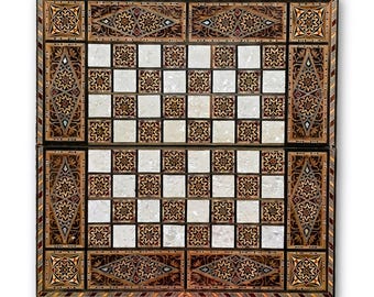 May include: A rectangular wooden game board featuring an alternating grid of white mother-of-pearl squares and dark wood squares inlaid with intricate star patterns. The border is decorated with geometric marquetry and star motifs.