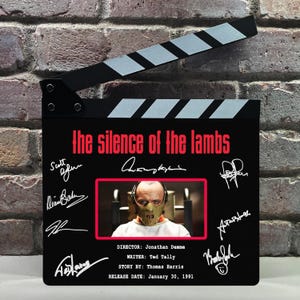 May include: A rustic wooden sign with the text "Welcome to our home" in white lettering. The sign features a distressed finish and a simple, inviting design, perfect for a front porch or entryway.