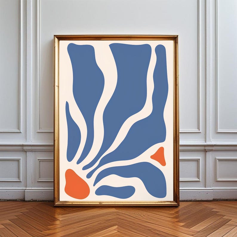 May include: A rectangular framed wall art piece featuring an off-white background with organic, flowing blue shapes radiating from the bottom left corner, accented by two distinct orange shapes positioned near the bottom and right side edges.