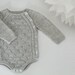 Tiriltunge Newborn onesie (english pattern)
