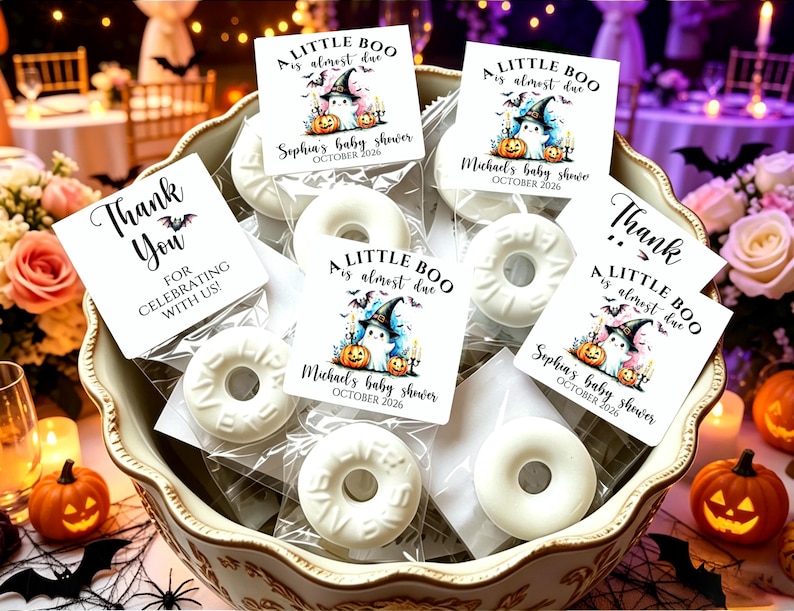 May include: White ring-shaped soaps in clear plastic bags with square tags featuring a ghost in a witch hat, pumpkins, and the text A LITTLE BOO is almost due, Sophia's baby shower, Michael's baby shower, and THANK YOU FOR CELEBRATING WITH US.