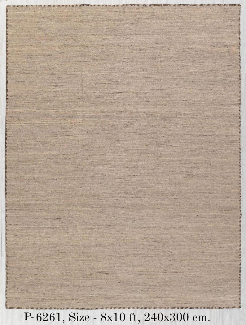 A full overhead view of the rectangular beige flatweave rug with brown stitched edges, with text overlay: "P-6261, Size - 8x10 ft, 240x300 cm."