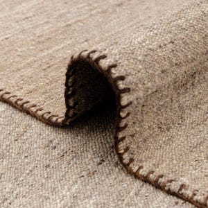 beige flatweave rug closeup