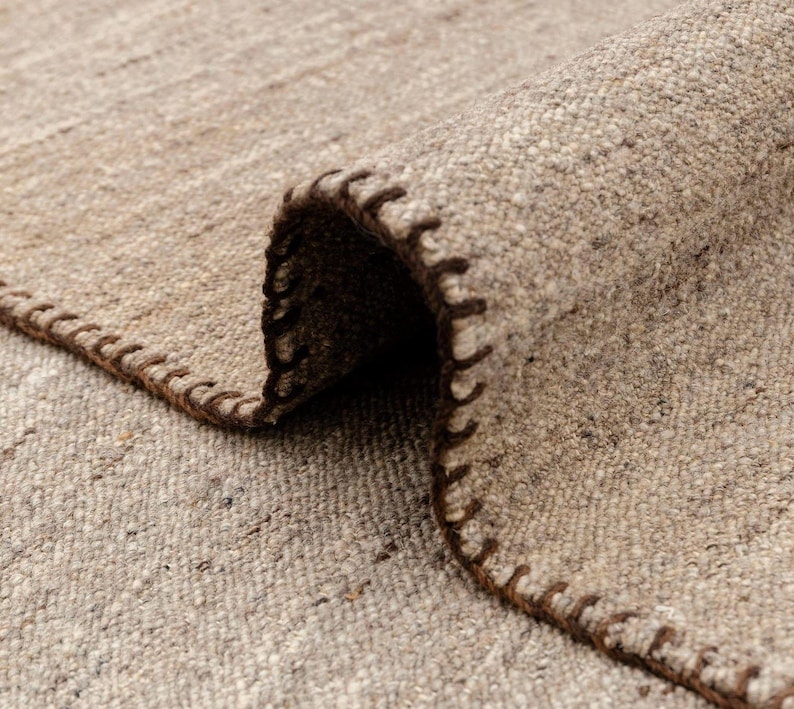 beige flatweave rug closeup