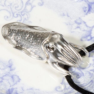 Cuttlefish pendant -- cute or just a little scary?  Polished bronze or textured silver