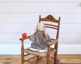 An Arts and Crafts Child’s Rocking Chair, c. 1900-1920