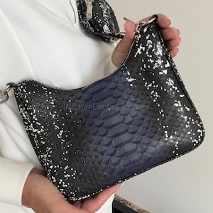 May include: A rustic wooden sign with the text "Welcome to our home" in white lettering. The sign has a distressed finish and a simple, inviting design, suitable for a front porch or entryway.