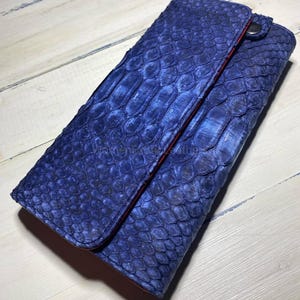 May include: A rustic wooden sign with the text "Welcome to our home" in white lettering. The sign has a distressed finish and a simple, inviting design, suitable for a front porch or entryway.