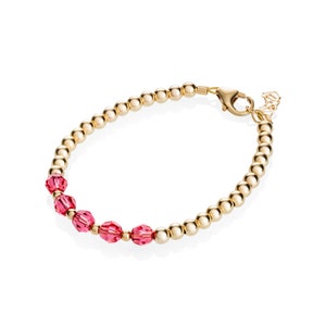 Gold bead with Hot Pink crystal center bracelet