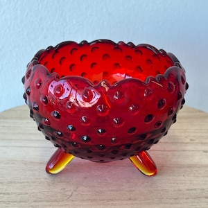 May include: A set of three ceramic vases in varying heights and shapes. The vases are glazed in a matte white finish, offering a minimalist aesthetic. The tallest vase is approximately 10 inches high.