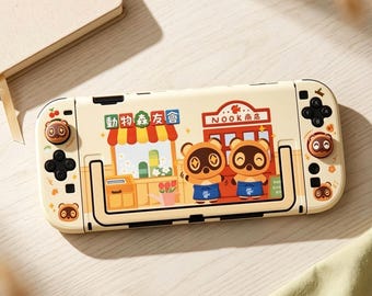 Animal Crossing Nintendo Switch Hülle – Niedliche Tom Nook Hülle für Switch 1, OLED & Switch 2, Gemütliches Gamer-Accessoire, Joy-Con Hülle und Daumenkappen
