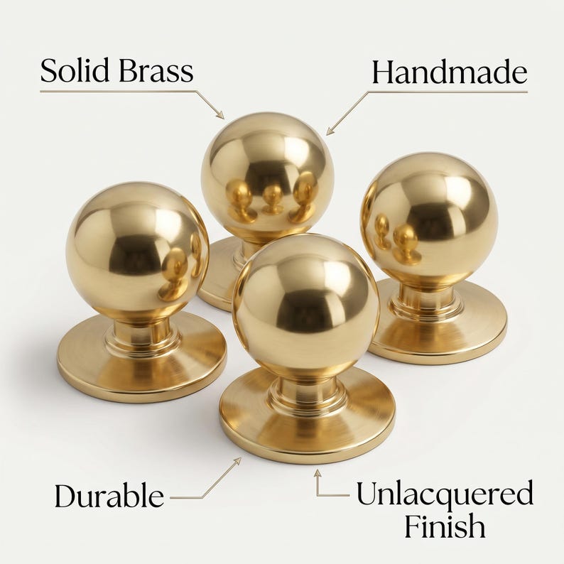 May include: Four solid brass, handmade door knobs with an unlacquered finish. The knobs are round with a polished, reflective surface. The image includes the words "Solid Brass", "Handmade", "Durable", and "Unlacquered Finish".