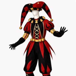 May include: A full-body shot of a jester costume. The outfit is primarily black and red, with gold accents. It includes a hat, a top with a laced bodice, pants, and boots. The jester costume is designed with a harlequin pattern.