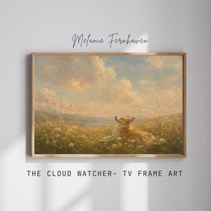 May include: A framed print titled "The Cloud Watcher" features a corgi dog lying in a field of wildflowers, gazing upwards at a cloudy sky. The artwork has a warm color palette with a light brown wooden frame. The artist's name, Melanie Fernhaven, is written at the top.
