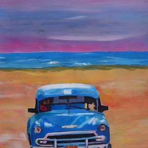May include: A blue vintage car parked on a sandy beach with a purple and pink sky in the background.