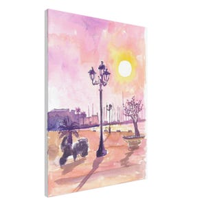 May include: Watercolor painting of a coastal scene at sunset. The artwork features a black scooter, a decorative lamp post, and a tree in a planter. The sky is a blend of pink and yellow hues, with a bright sun.