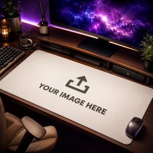 May include: A large, rectangular, light-coloured desk mat featuring a dark grey upload icon and the text "YOUR IMAGE HERE" printed in the centre. The mat is positioned on a dark wooden desk surface in front of a computer monitor and keyboard.