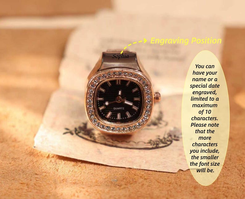 May include: A rose gold ring watch with a square black face and a crystal-studded bezel. The watch has the word "QUARTZ" on the face. The text "Sophia" is above the watch face. The image also includes text about engraving.