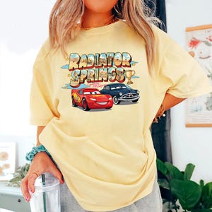 May include: A trio of ceramic mugs with a speckled, matte finish in cream, light grey, and dark grey. Each mug features a simple, minimalist design, ideal for tea or coffee.