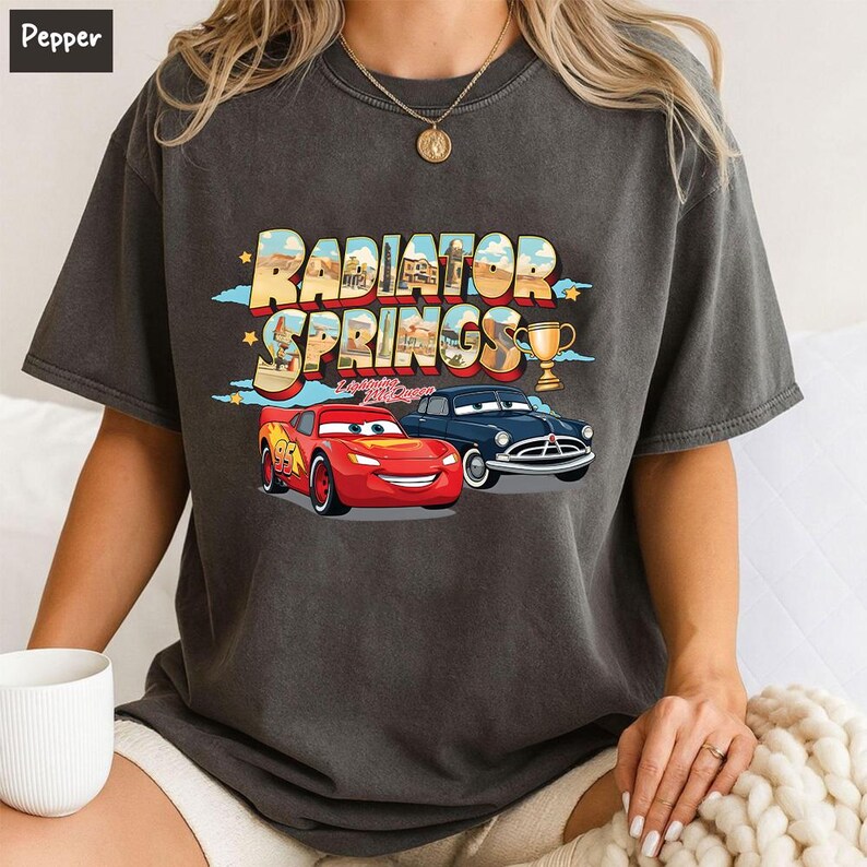 May include: A set of three ceramic mugs with a speckled, matte finish in cream, light grey, and dark grey. Each mug has a simple, minimalist design and a rounded handle.