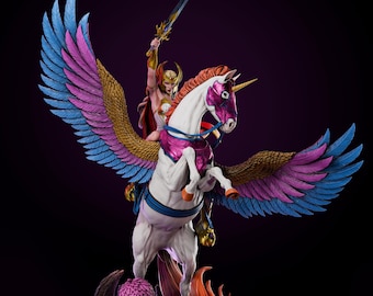 May include: A detailed figurine of a warrior riding a winged unicorn. The warrior is clad in gold and red armor, holding a sword aloft. The unicorn has a white body, purple and pink accents, and large wings with blue, pink, and gold feathers. The base is a rocky landscape.