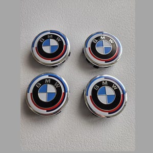 Set (4) BMW 50th Anniversary 68mm Wheel Center Caps – White Blue Alloy Emblem