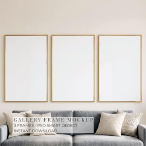 May include: Three vertical rectangular frames with thin gold borders arranged side by side. The frames contain blank white inserts. The text "GALLERY FRAME MOCKUP 3 FRAMES • PSD SMART OBJECT INSTANT DOWNLOAD" is centered over the frames.