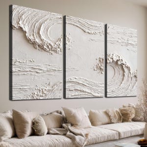 May include: A triptych of three rectangular canvases featuring a white, monochromatic, textured relief sculpture of ocean waves. The thick, impasto-style paint creates swirling, raised patterns that mimic the movement of crashing water.