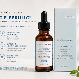 May include: A brown glass bottle of SkinCeuticals C E Ferulic Combination Antioxidant Serum with a black dropper. The product is displayed next to its light blue box, which reads "Prevent". The label lists ingredients and benefits for skin.