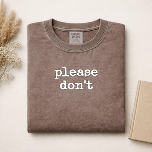 Brown Comfort Colors sweatshirt with "please don't" printed on front.