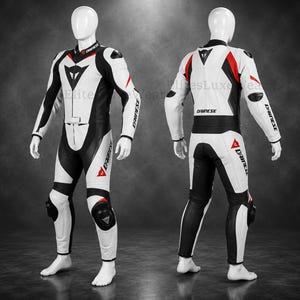 May include: A white and black motorcycle racing suit with red detailing. The suit has a sleek design, with the brand name "DAINESE" printed on the sleeves and legs. The suit is displayed on a mannequin.